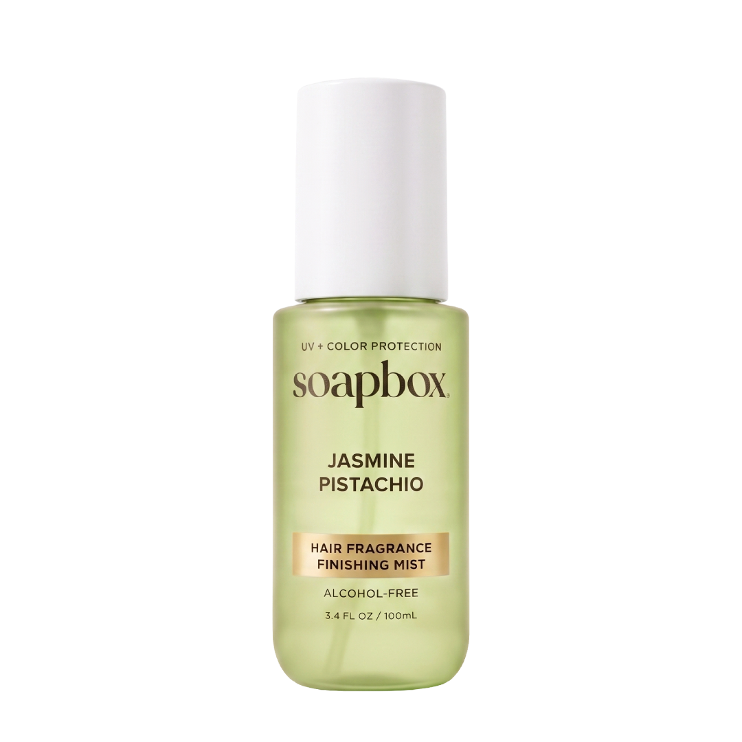 Soapbox Jasmine Pistachio hair fragrance mist in pale green bottle with white cap, labeled UV + Color Protection, 3.4 fl oz.