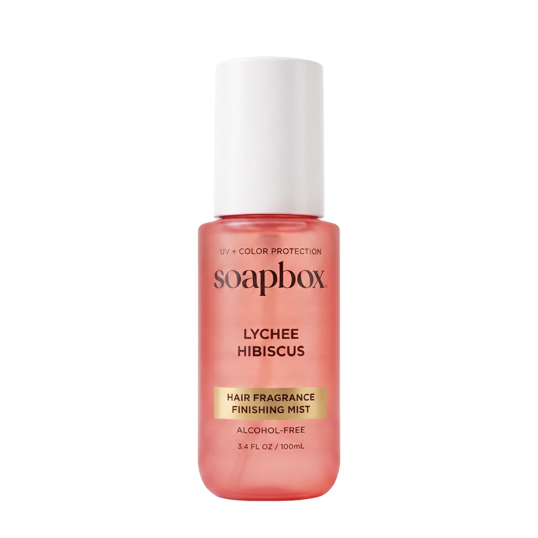Soapbox Lychee Hibiscus hair fragrance mist in coral-pink bottle with white cap, 3.4 fl oz.