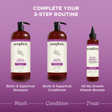 Two brown pump bottles labeled Biotin & Superfruit Shampoo and Conditioner with smaller Vitamin Booster bottle on purple back