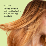 Person with long, straight auburn hair flowing against a pale green background.