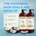 Two brown pump bottles of Soapbox Coconut & Shea shampoo and conditioner next to split coconut on light blue background.