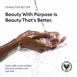 Hands with water and shampoo lather demonstrating product cleansing action.