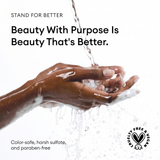Open hands with water cascading over them, displaying product benefits text and cruelty-free certification badge.