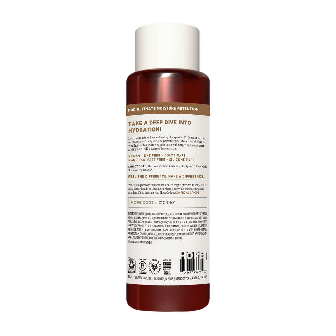 Cylindrical shampoo bottle with white cap and dark red liquid, featuring product information and ingredient list on label.