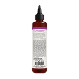 Dark amber liquid vitamin booster in a bottle with black pointed cap and purple label band.