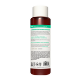 Dark red conditioner bottle with white cap and green label band featuring product information and certifications.