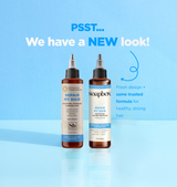 Two bottles of Repair My Hair Vitamin Booster Treatment with dropper caps on light blue background.