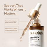Soapbox Clinical ProGro Density scalp and hair serum with dropper and callouts that it promotes stronger, fuller-looking hair.