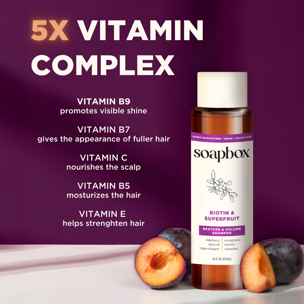 Soapbox Biotin & Superfruit volumizing shampoo bottle with purple label displayed with fresh berries on purple background.