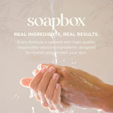 Hands cupped under running water with soapy lather, demonstrating liquid hand soap in use.