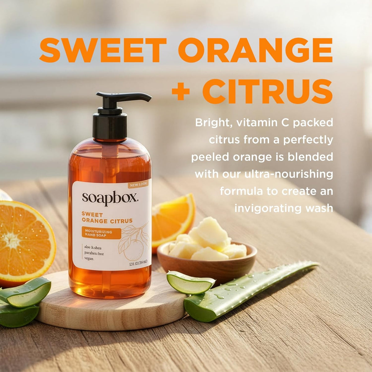 Soapbox sweet orange citrus liquid hand soap bottle with pump dispenser surrounded by orange slices and aloe vera.