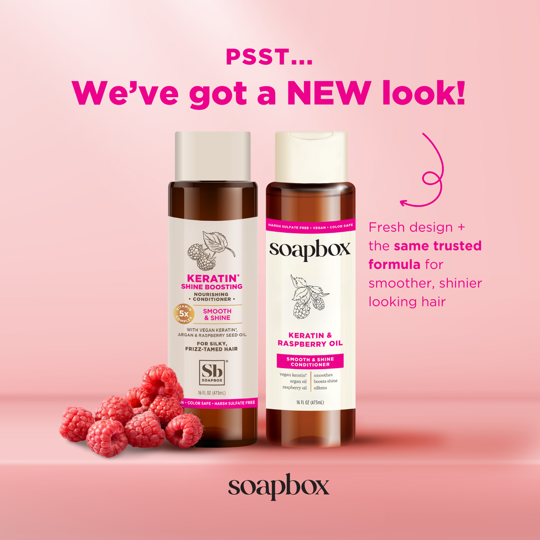 Two brown bottles with white caps on pink background surrounded by fresh raspberries, displaying keratin and raspberry seed o