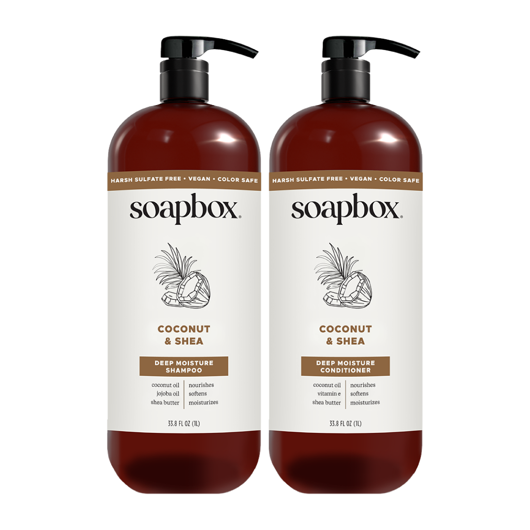 Two dark amber bottles with black pump dispensers labeled Soapbox Coconut & Shea Deep Moisture Shampoo and Conditioner, 33.5 