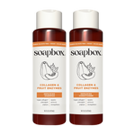 Two Soapbox bottles with cream caps and burgundy lower sections labeled "Collagen & Fruit Enzymes Repairing Shampoo" and "Rep