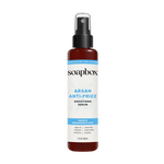 Soapbox Argan Anti-Frizz Smoothing Serum in a 5 fl oz amber bottle with black spray top and blue label.