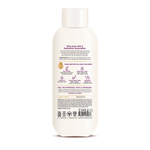 Cream-colored bottle of nourishing body wash with white cap and product information label on front.