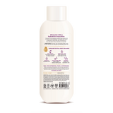 Cream-colored bottle of nourishing body wash with white cap and product information label on front.