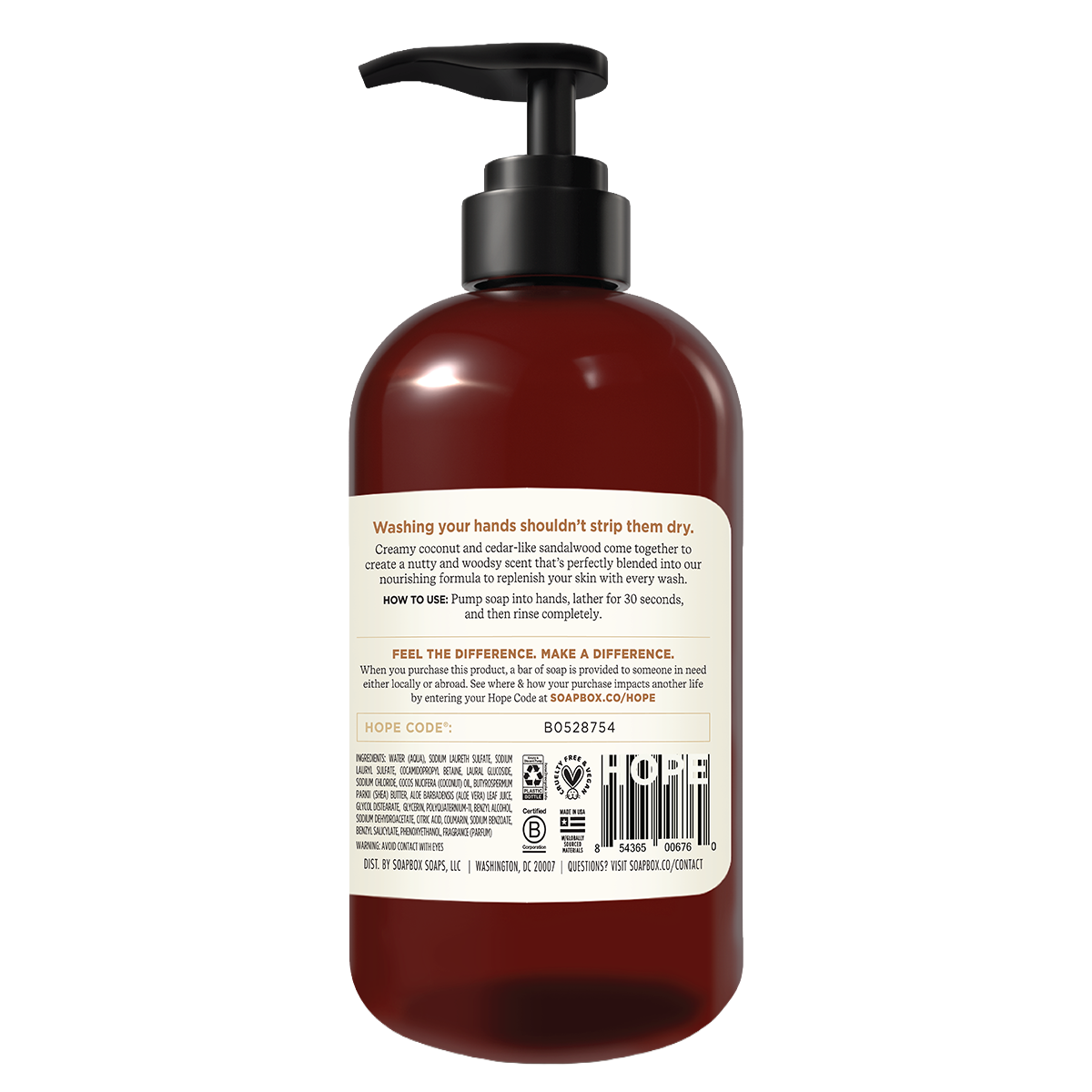 Dark amber glass bottle with black pump dispenser and cream-colored label containing liquid hand soap.
