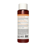 Dark amber bottle with white cap containing repairing shampoo, labeled with product information and certifications.