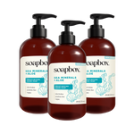 Three brown pump bottles of Soapbox Sea Minerals + Aloe Moisturizing Hand Soap with cream and teal labels.
