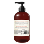 Dark amber glass bottle with black pump dispenser and cream-colored label containing vanilla bean hand soap.