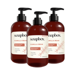 Three dark amber bottles of Soapbox Vanilla Bean Moisturizing Hand Soap with black pump dispensers and cream-colored labels.