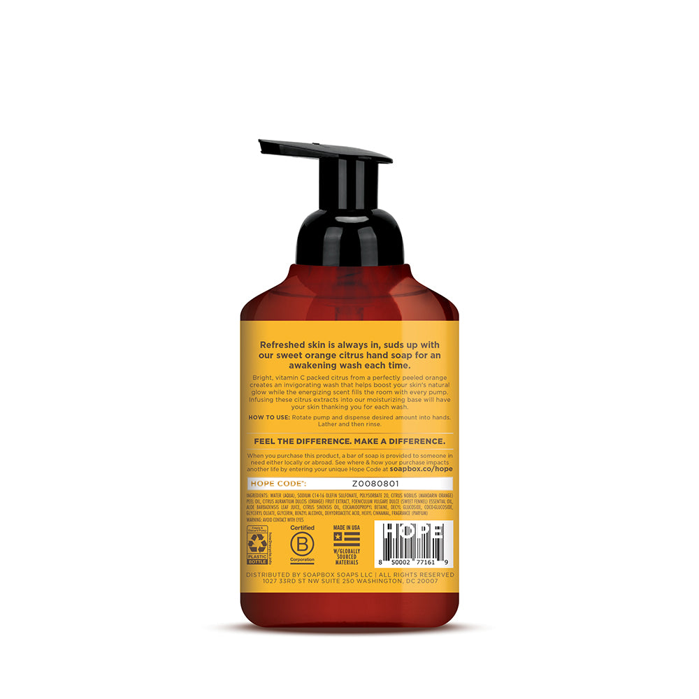 Foaming hand soap bottle with black pump dispenser, amber and red gradient label with product information.