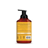 Foaming hand soap bottle with black pump dispenser, amber and red gradient label with product information.