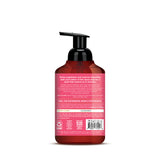 Pink and red foaming hand soap bottle with black pump dispenser and product information label on back.