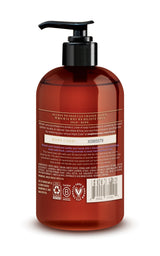 Clear amber liquid hand soap in a round bottle with black pump dispenser and product label.