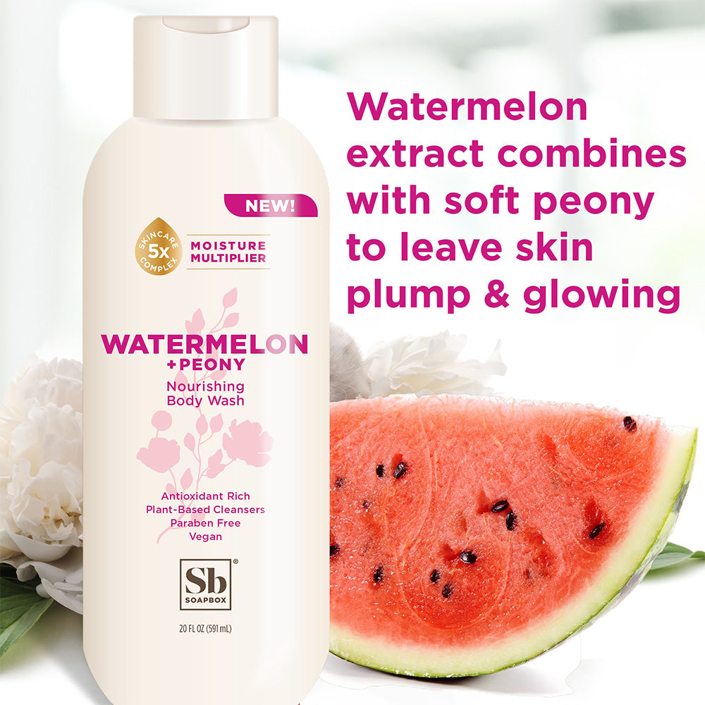 Cream-colored body wash bottle with peony flowers and watermelon slice displayed alongside.